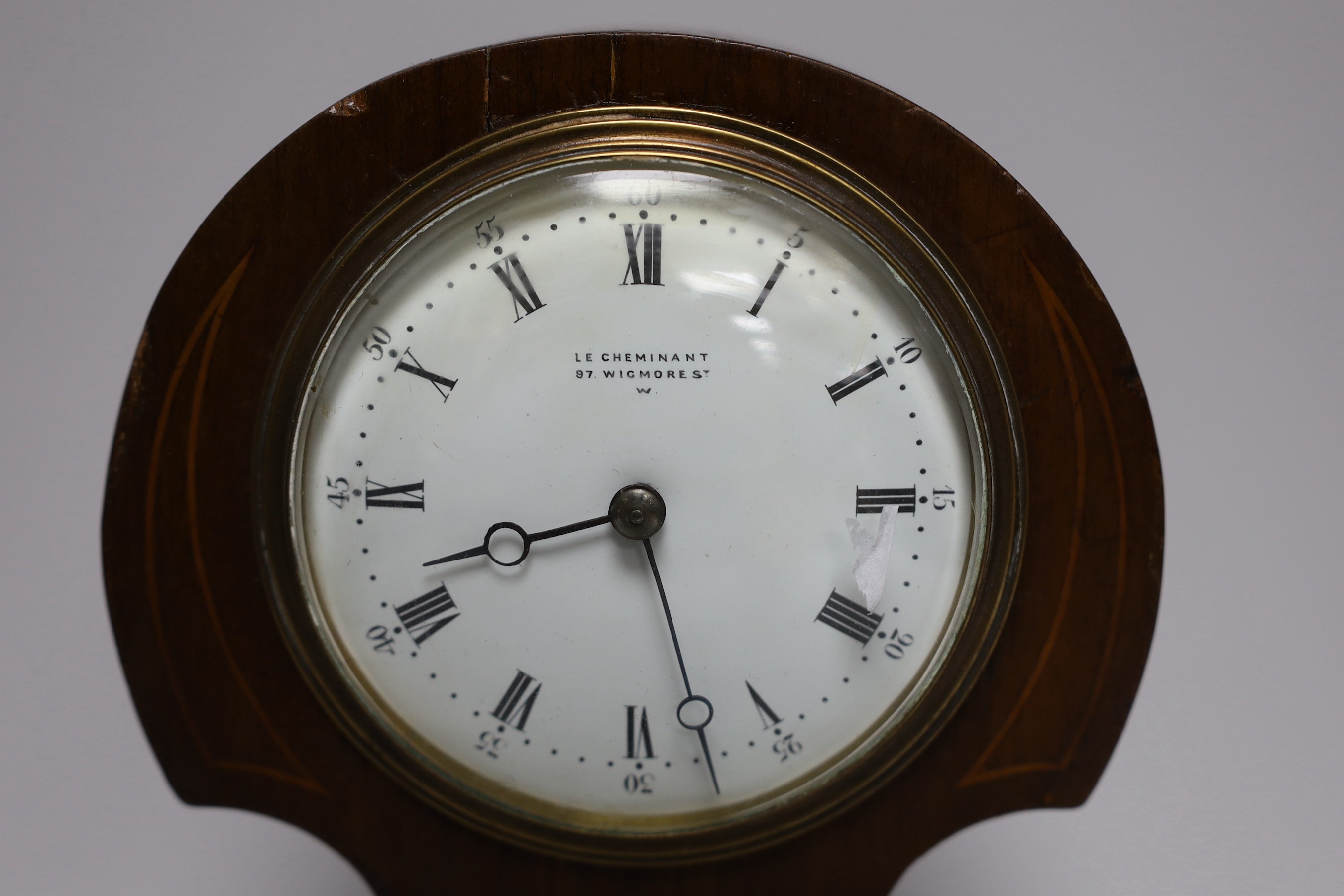 An Edwardian inlay mahogany timepiece, 26cms high